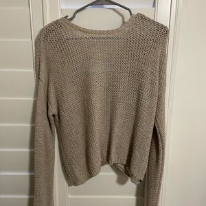 Beige cropped sweater with open back